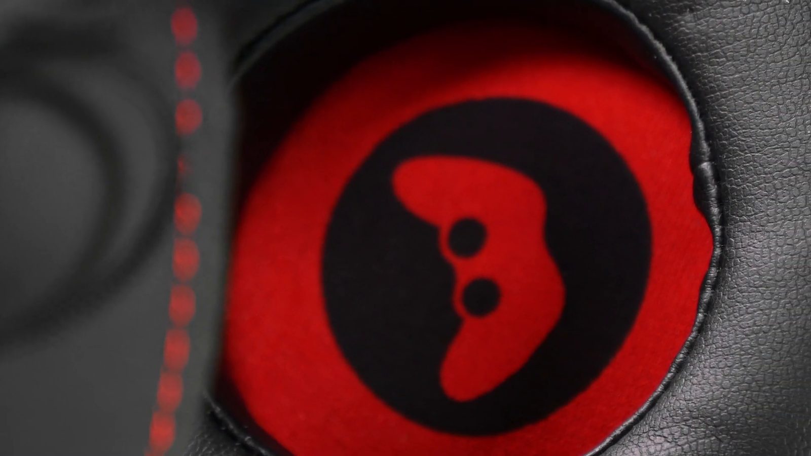 Close-up of the HCG1 red inner ear pad with white gamepad icon