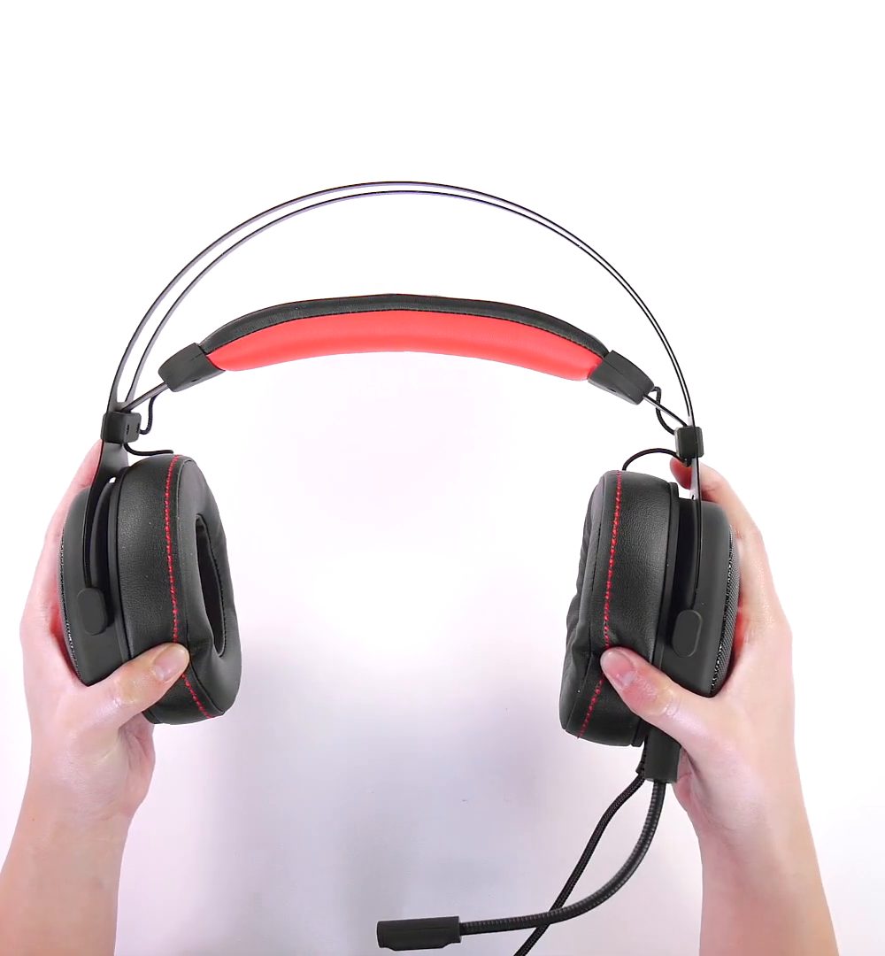 Two hands holding the HCG1 from the front