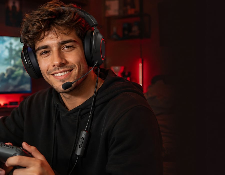 Streamer wearing the HCG1 headset in a cozy creator setup
